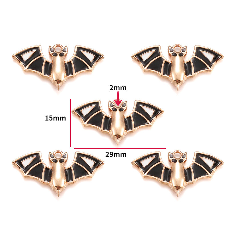 Five rose gold-tone bat charms with black enamel wings, 15mm by 29mm