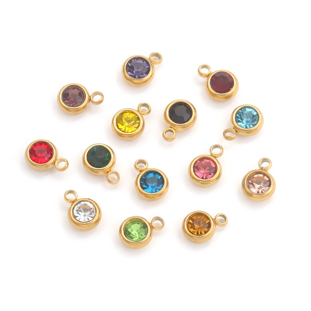 Twelve gold-tone round crystal birthstone charms with loops, assorted colors
