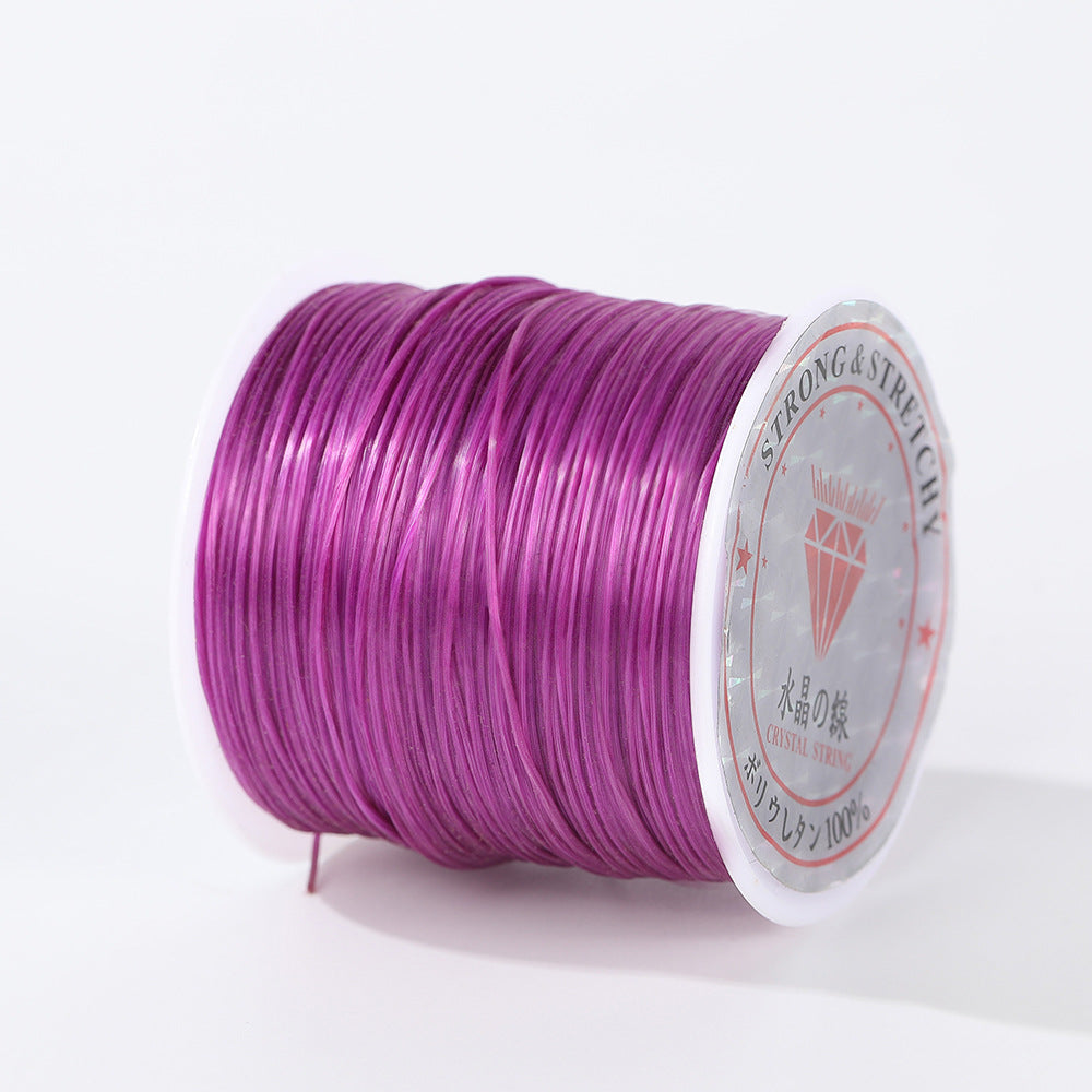 Spool of vibrant purple 0.8mm flat elastic beading cord on its side, holographic diamond label, white background