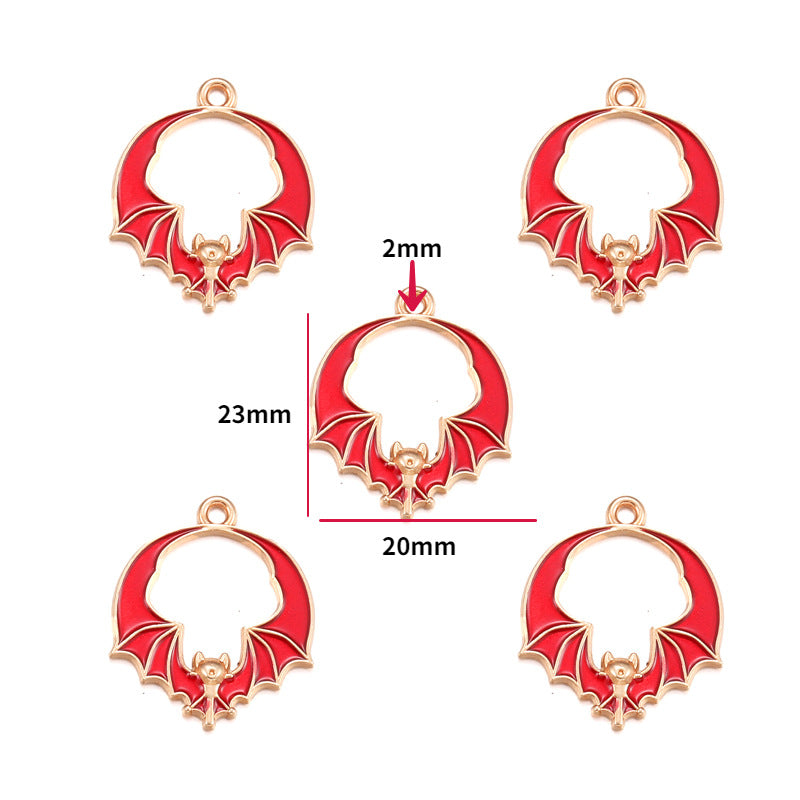 Five red and gold bat-shaped charms, 23mm by 20mm