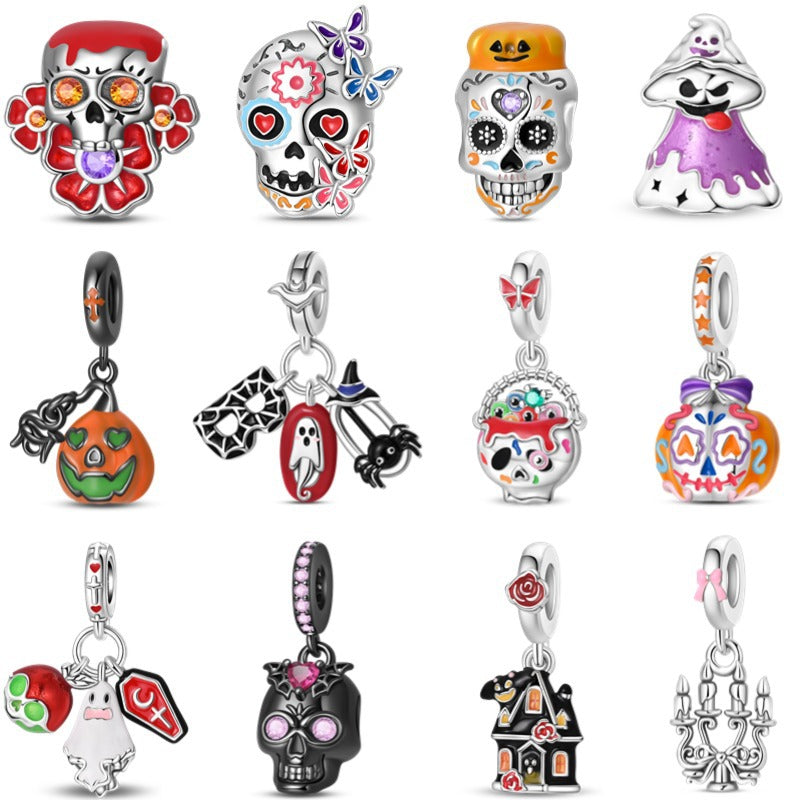 Group of 12 silver-plated Halloween enamel pendant charms: sugar skulls, ghost, pumpkin, haunted house, skull, and bat designs