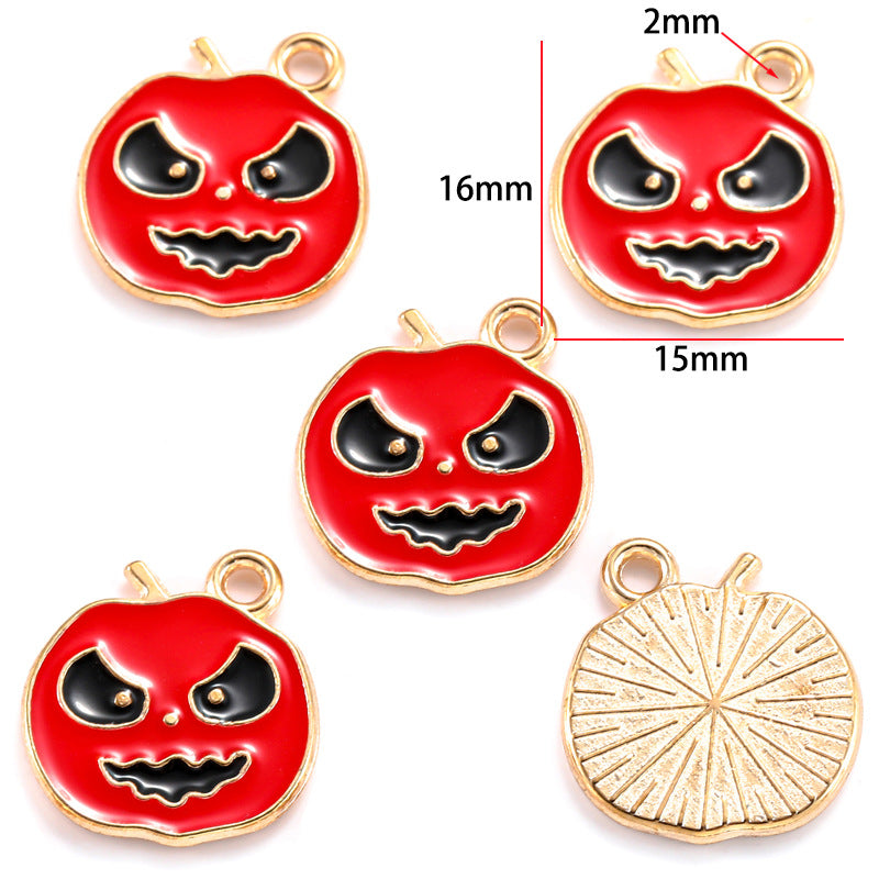 Five pumpkin-shaped charms with red enamel and gold-tone edges, 16mm by 15mm