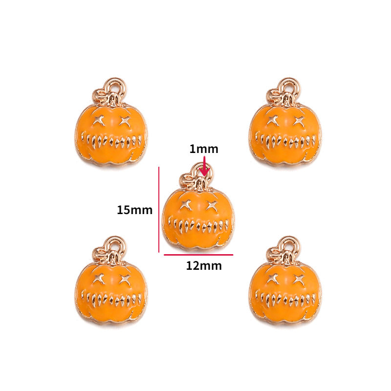 Five orange pumpkin-shaped charms with gold-tone metal outlines and loops, shown on a white background with one center charm highlighted and dimension labels reading 15mm, 12mm, and 1mm.