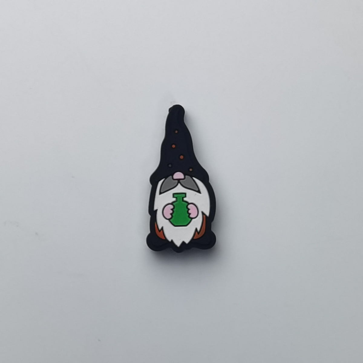 Gnome wizard silicone focal bead with black pointy hat, white beard, and green potion bottle