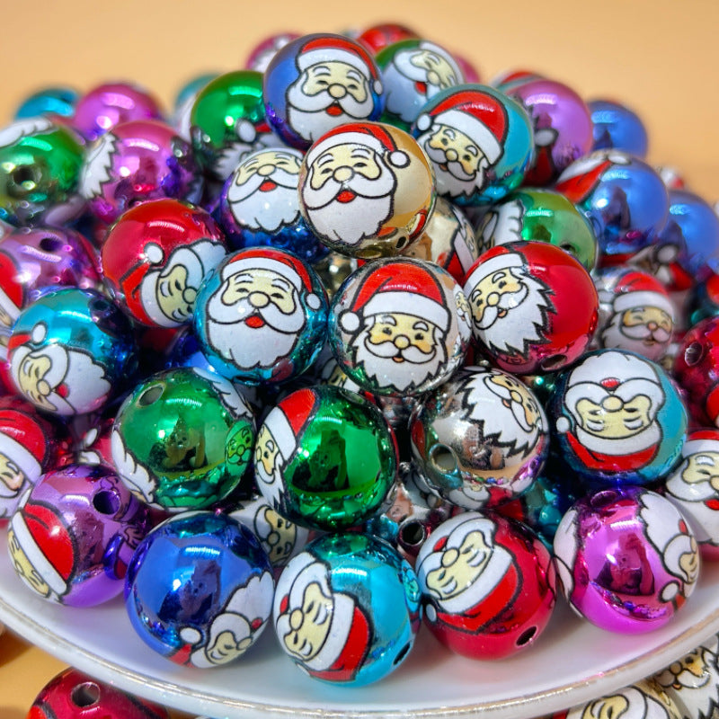 Colorful Christmas printed acrylic round beads on a white plate