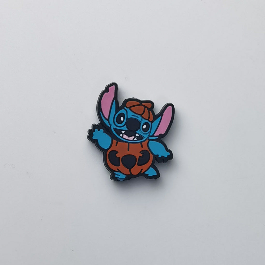 Blue cartoon character bead with pink ears and brown body