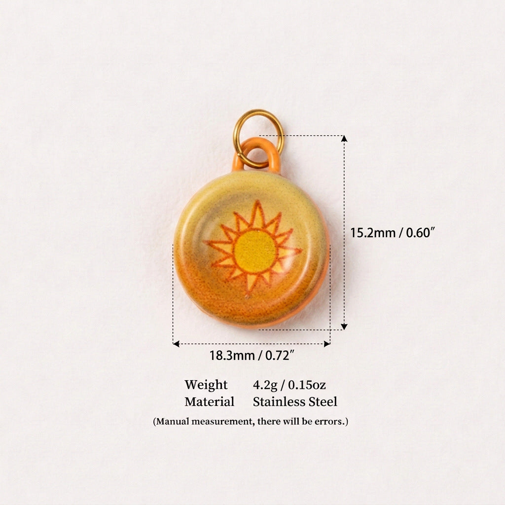 Round yellow-orange pendant charm with sun design, shown with size measurements.