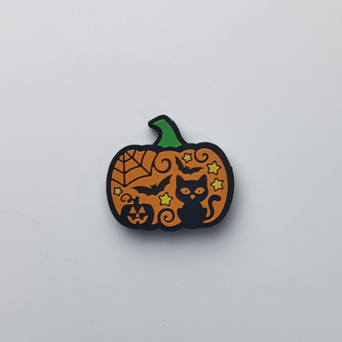 Pumpkin-shaped bead with black cat and jack-o'-lantern motifs