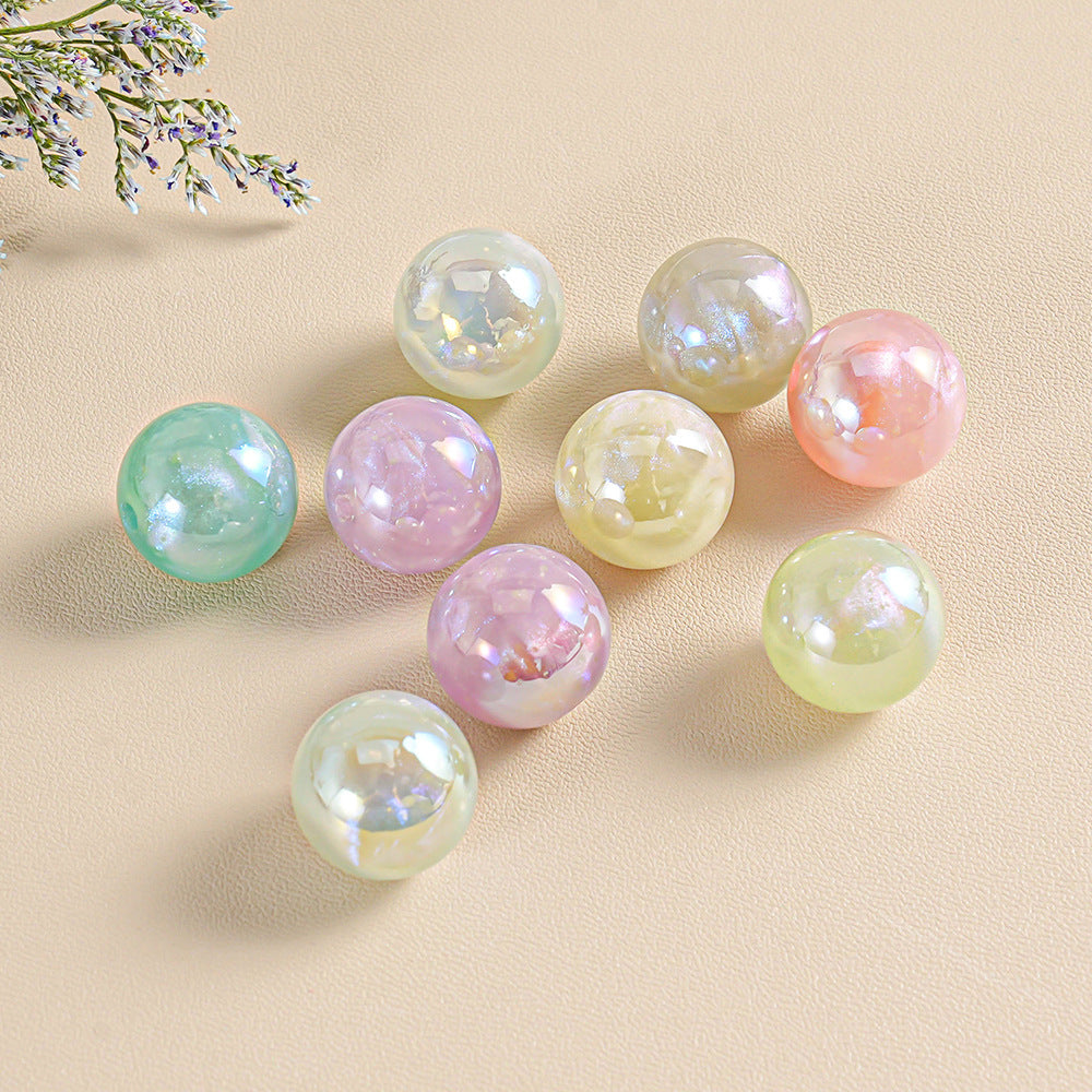 Nine iridescent glass beads in pastel mint green lavender pink pale yellow