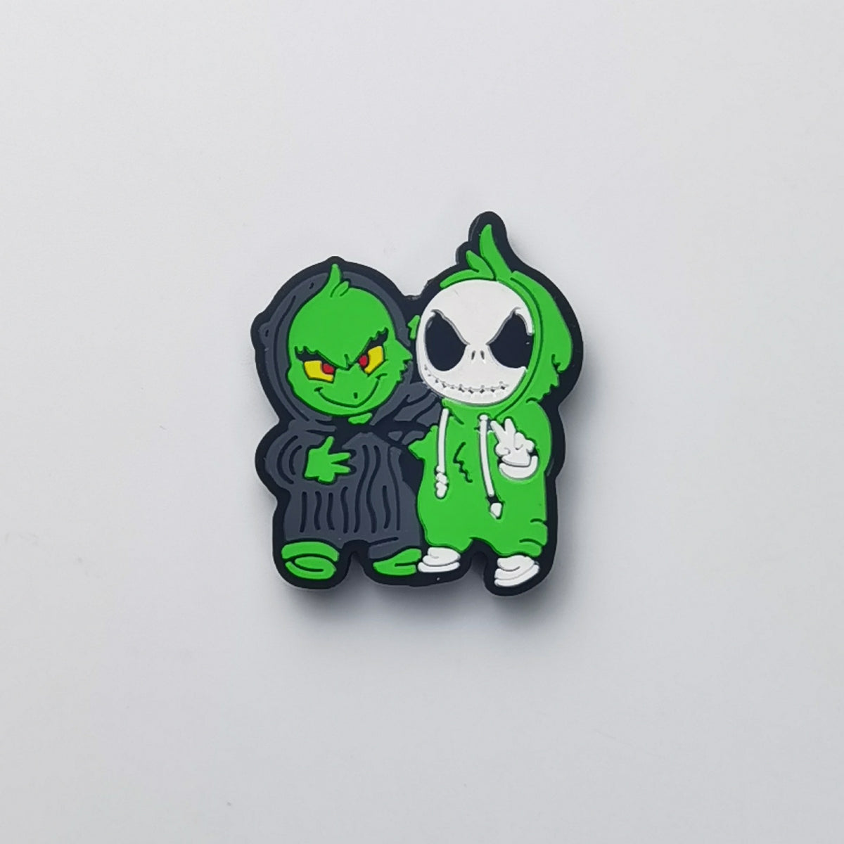 Green cartoon duo bead with Grinch-like and skull-face characters