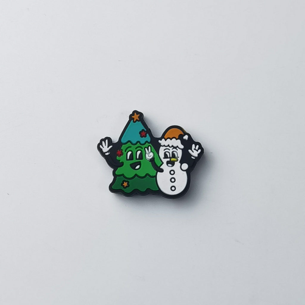 Green Christmas tree and white snowman silicone focal bead, both waving, with orange star and Santa hat