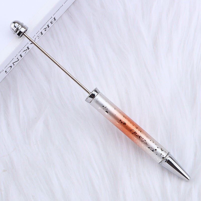 Metallic ombre beadable pen with gradient design on a white surface.
