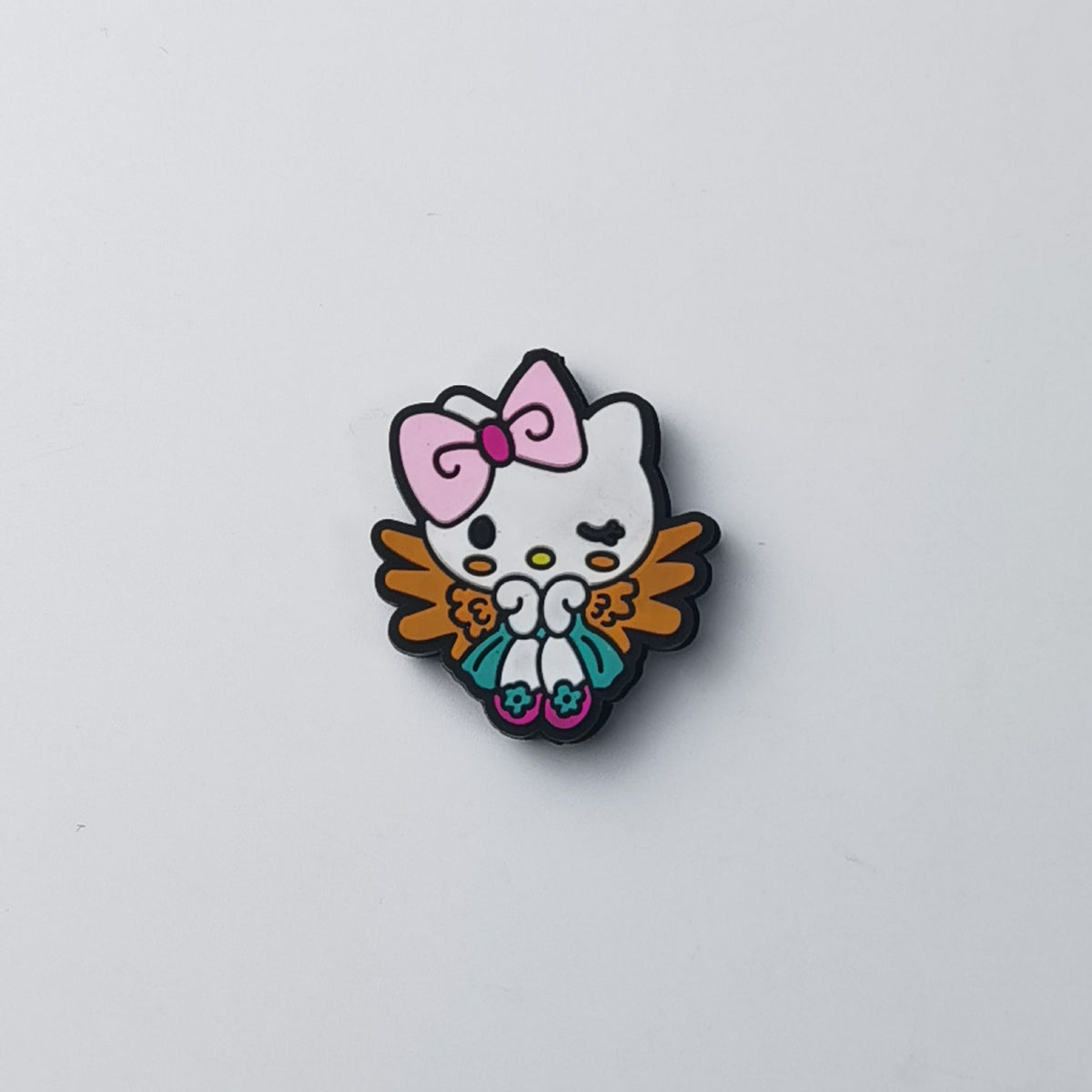 Hello Kitty silicone focal bead with pink bow, white face, brown wings and teal shoes