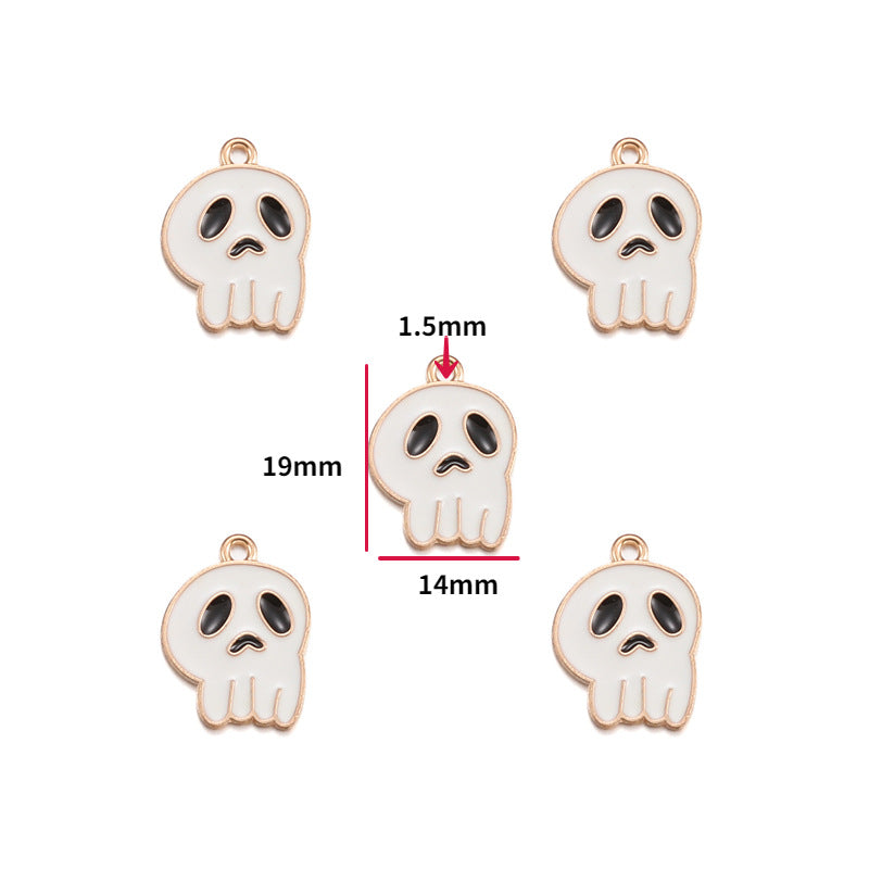 Five white skull-shaped jewelry charms with black eyes and gold-tone outlines are shown on a white background, with one central charm annotated with dimensions 19mm, 14mm, and 1.5mm.