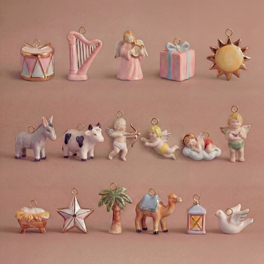 Collection of small ceramic figurines on a pink background