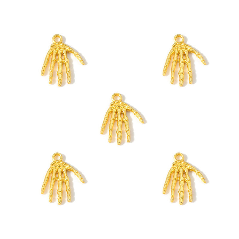Five small gold-toned skeletal hand charms arranged on a plain white background.
