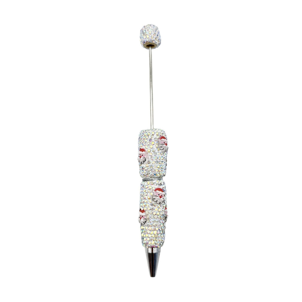 White rhinestone beadable ballpoint pen with red Santa patterns.