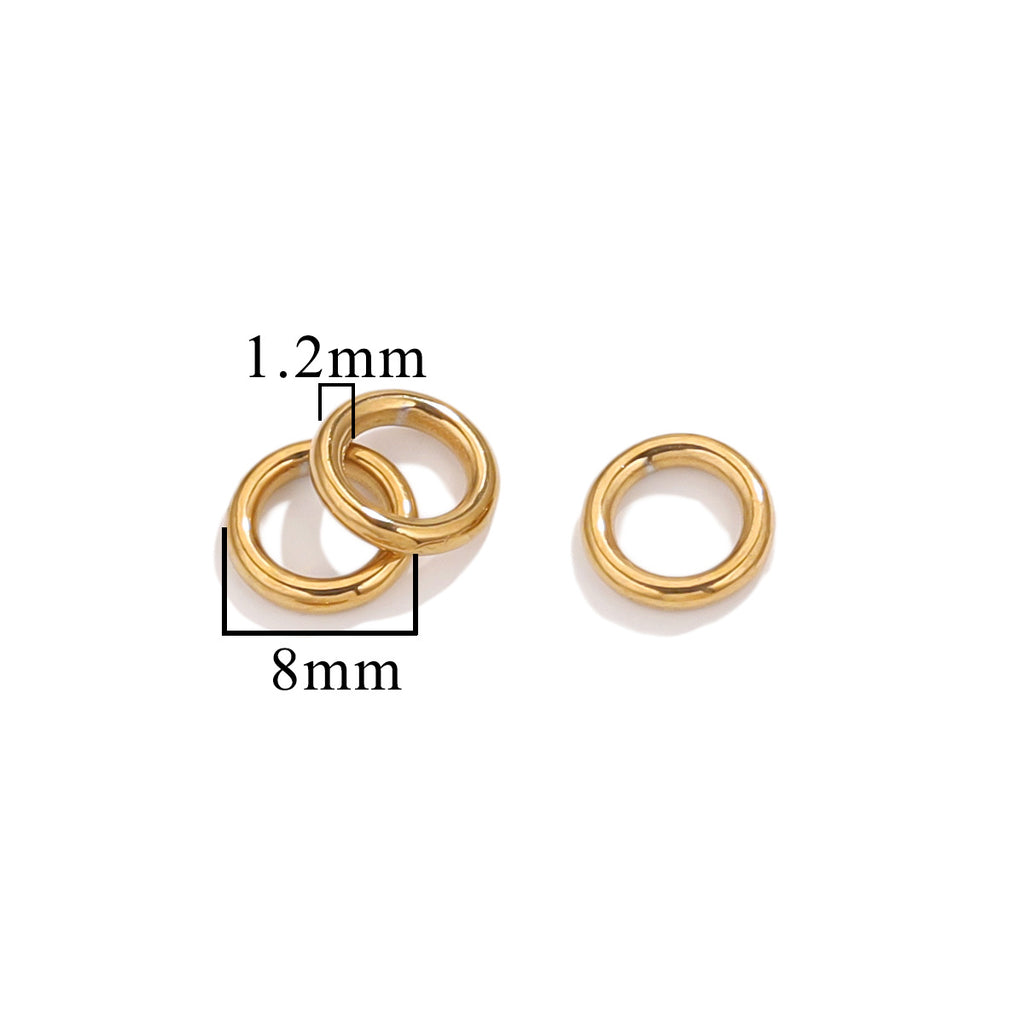 Three gold-tone closed jump rings, 8mm size with 1.2mm wire thickness, on white background
