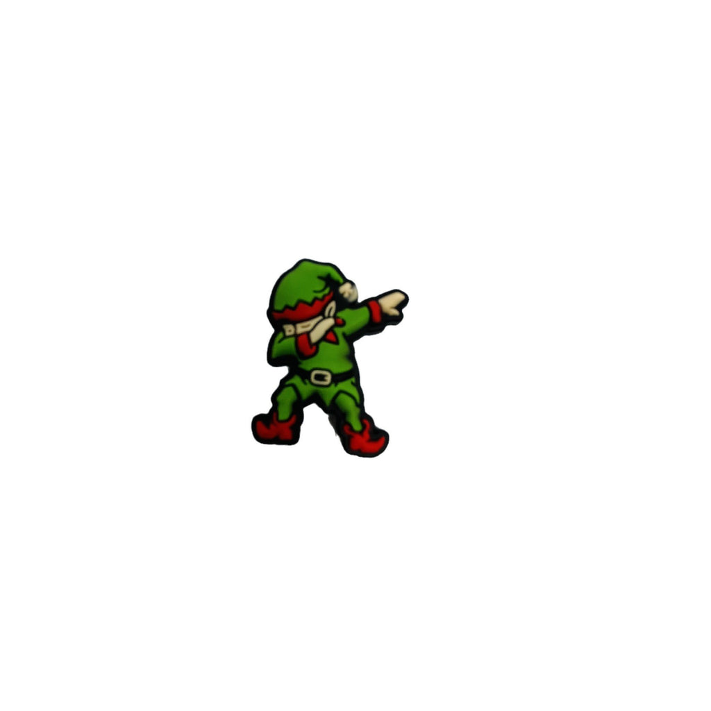 Dabbing green elf silicone focal bead with red boots and red hat trim on a white background.