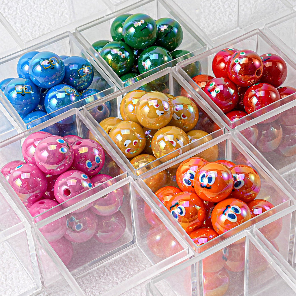 Colorful resin round beads with cartoon faces in clear acrylic bins, blue green red yellow pink orange