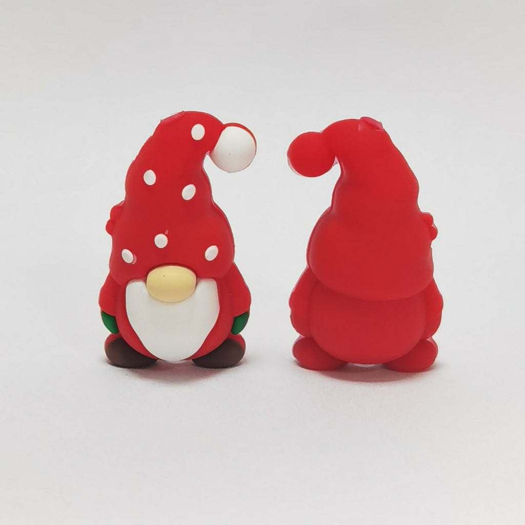 Two red gnome silicone focal beads with white polka dots, one facing forward and one showing back of hat