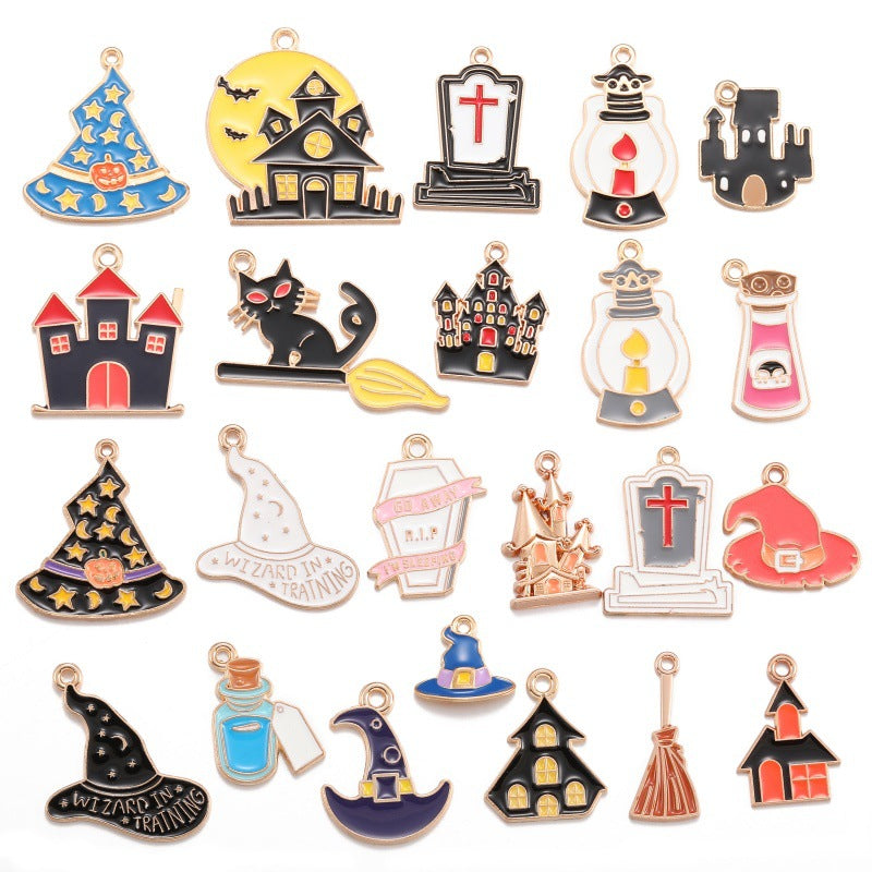 A set of 20 small enamel Halloween-themed charms with gold-tone metal borders and hanging loops, arranged in a grid on a white background. The charms depict a witch's hat, haunted house, tombstone, lantern, black cat on a broom, castle, potion bottle, gravestone, haunted cottage, witch hat, potion jar, broom, and a small house.