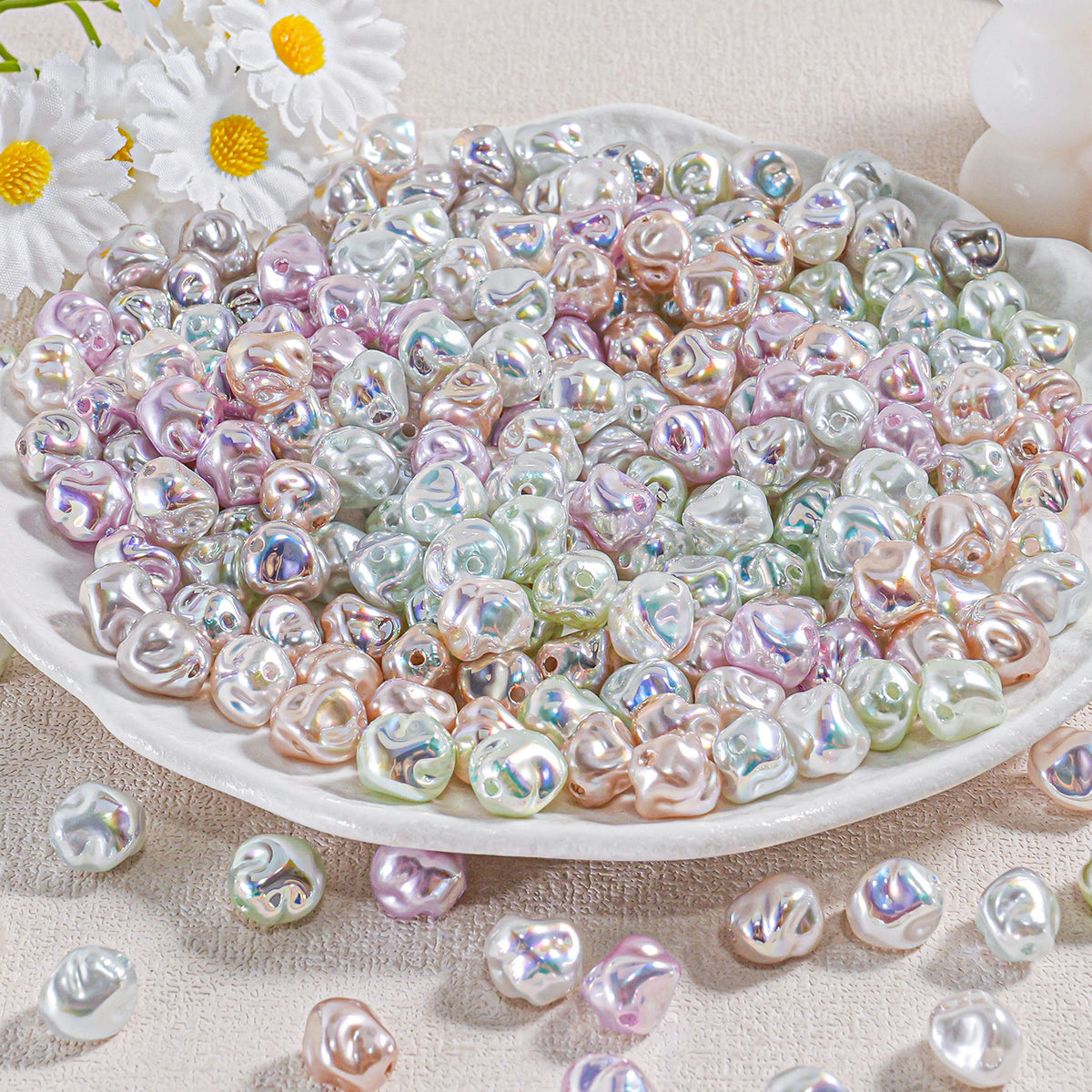 A plate piled with iridescent baroque faux pearl beads in pastel pink, green, blue and white