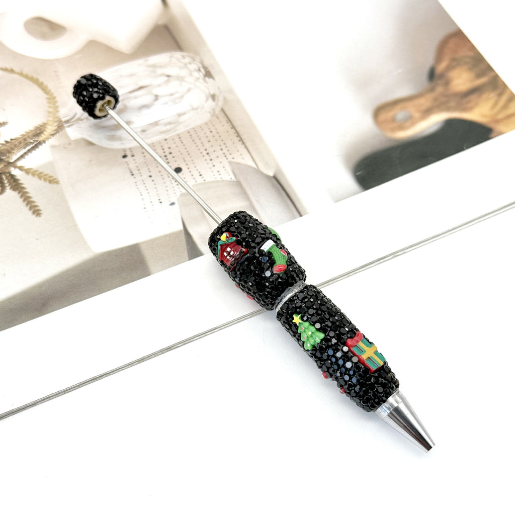 Christmas rhinestone ballpoint pen with cartoon design.