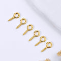 Five small gold-colored screw eye pins arranged diagonally on a white background