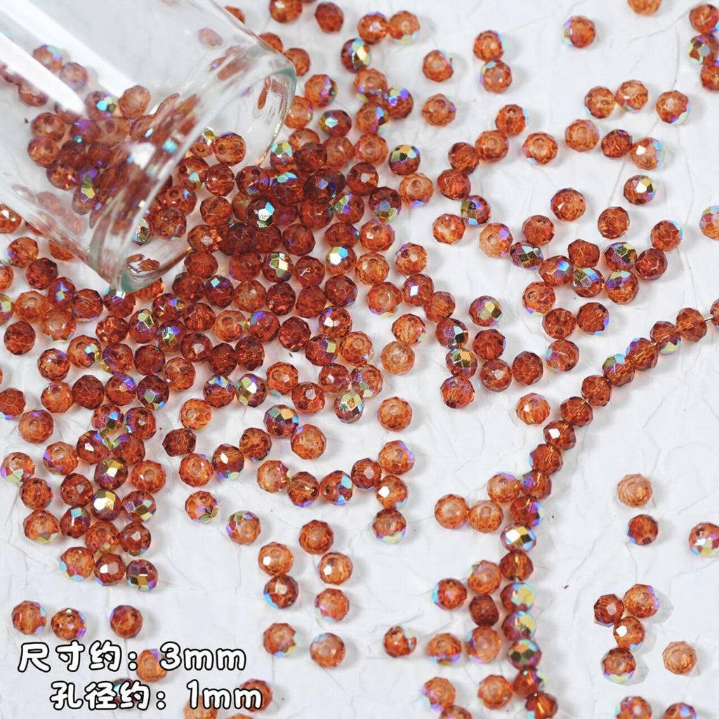 Faceted round beads in a warm coppery orange-brown color with an iridescent AB finish, shown spilling from a clear glass bottle onto a white textured surface. Chinese text in the bottom-left corner indicates the approximate size: 3mm diameter and 1mm hole diameter.