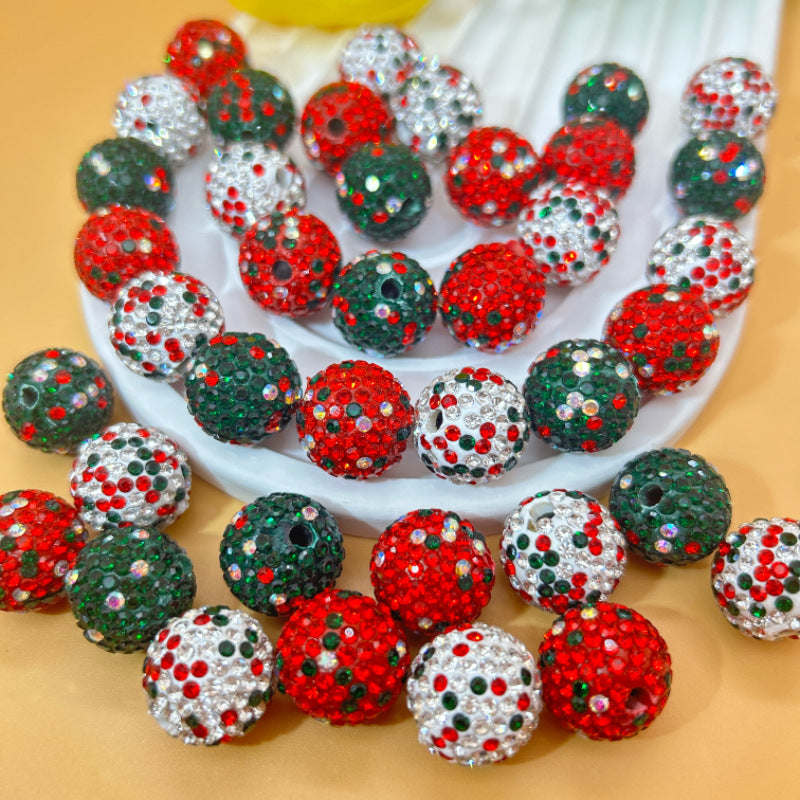 Colorful glittery Christmas beads on a white string.
