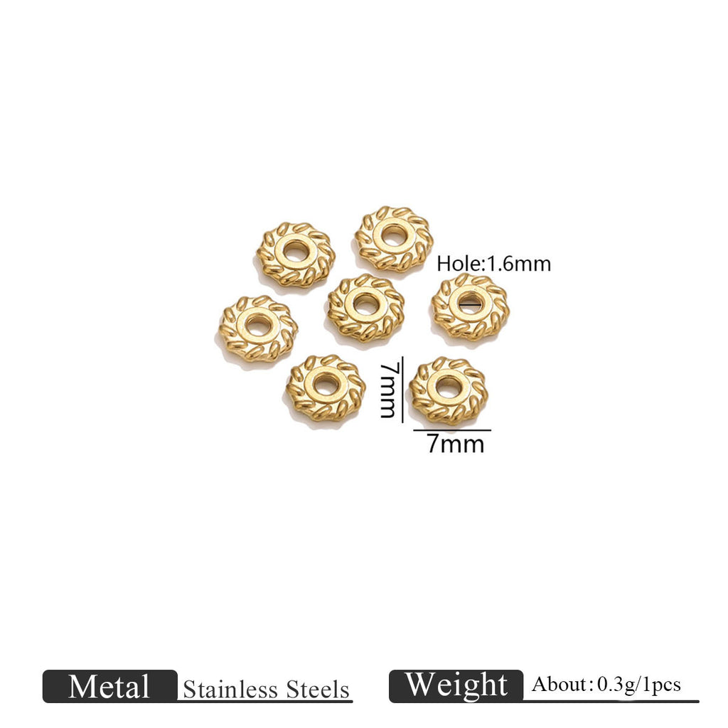 Six small gold-toned metal beads with a textured flower-like outer edge and a central hole shown