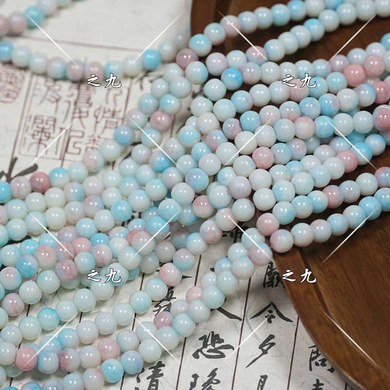 Close-up of pastel round porcelain beads in light blue, pink, white