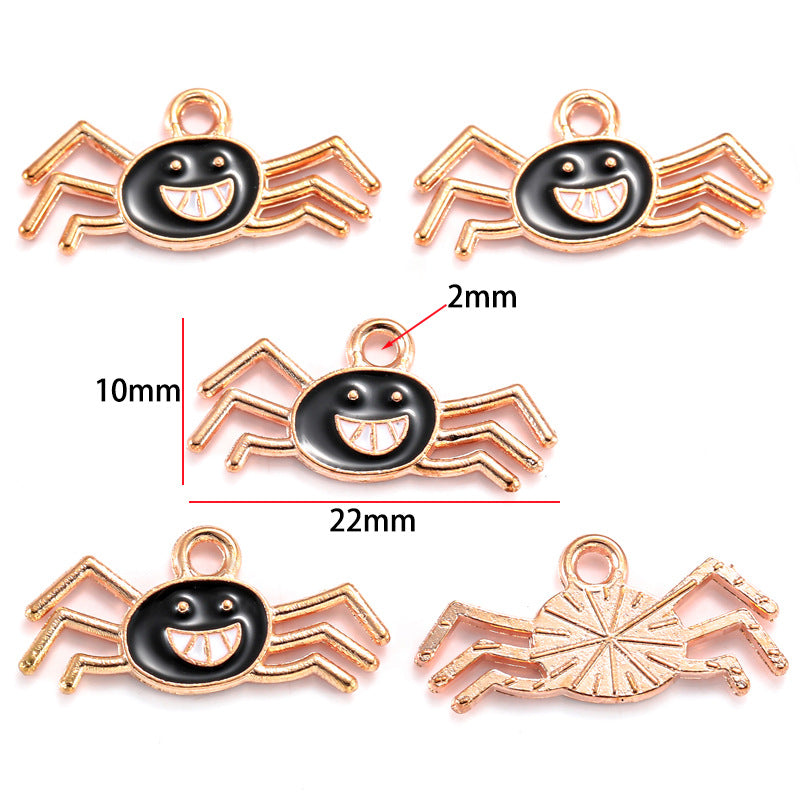 Five spider-shaped charms with black enamel face and rose gold body, 10mm by 22mm
