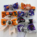 Six Halloween grosgrain ribbon bow focal beads with pumpkin, ghost, bat, and skull charms