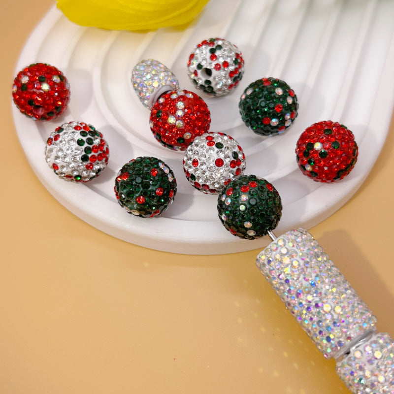 Colorful glittery Christmas beads on a white plate.