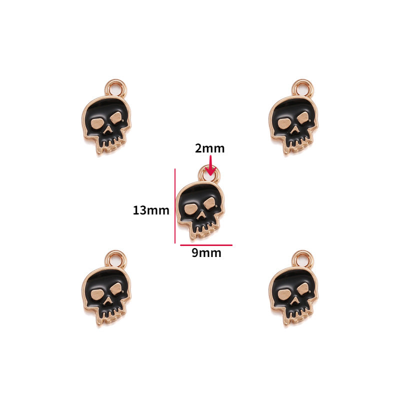 Five black enamel skull charms with rose gold borders, 13mm