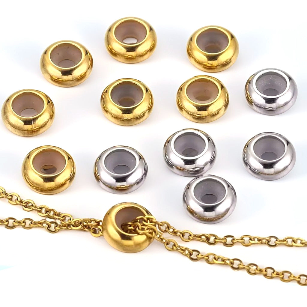 Gold and silver stainless steel flat abacus stopper beads with silicone lining, one threaded on gold chain