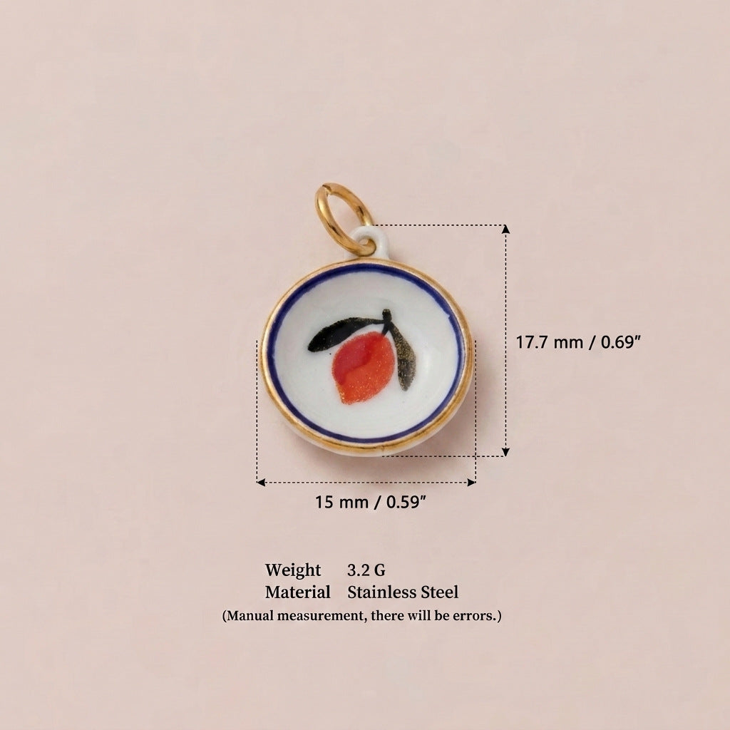 Round pendant charm with orange fruit and leaf design, shown with size measurements.