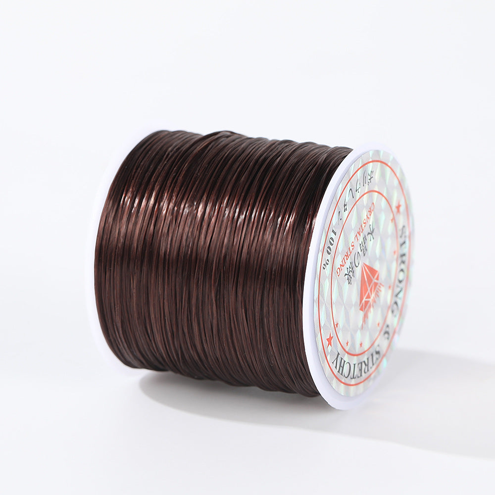 Spool of dark brown 0.8mm flat elastic beading cord wound on a white plastic spool, white background