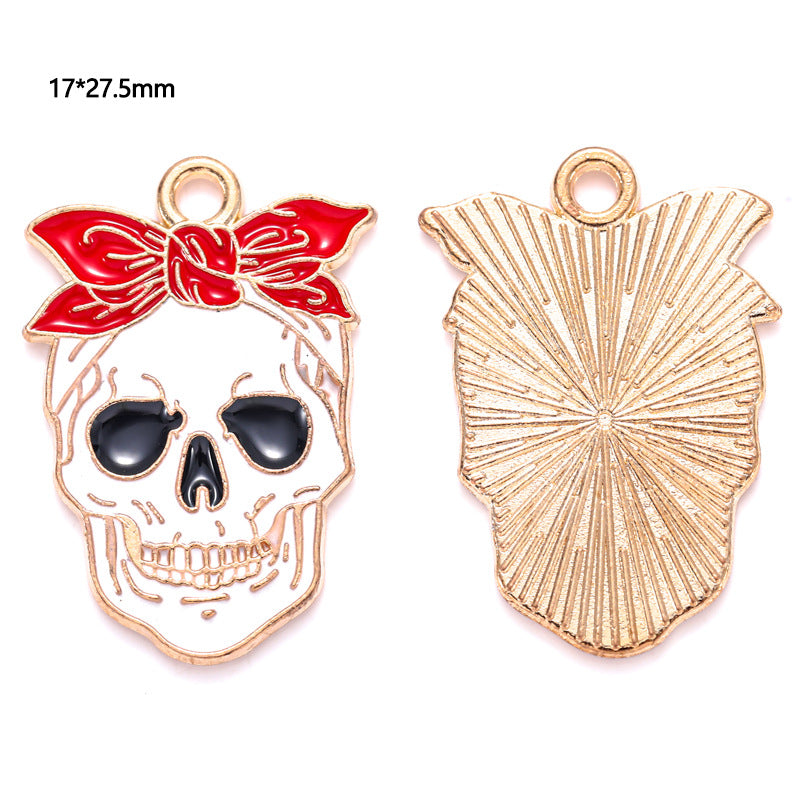 Two gold-tone skull charms with red bandana, front and back, 17 by 27.5mm