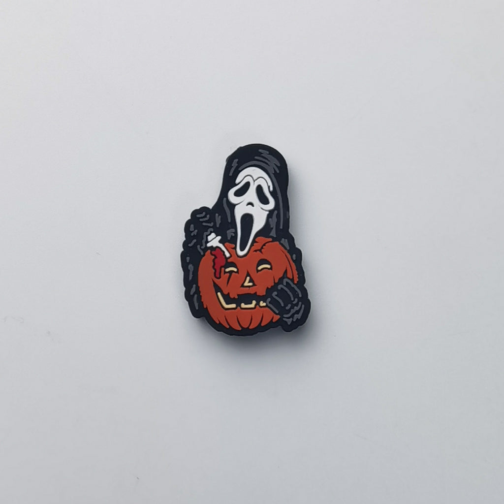 Ghostface bead with black hood holding orange pumpkin
