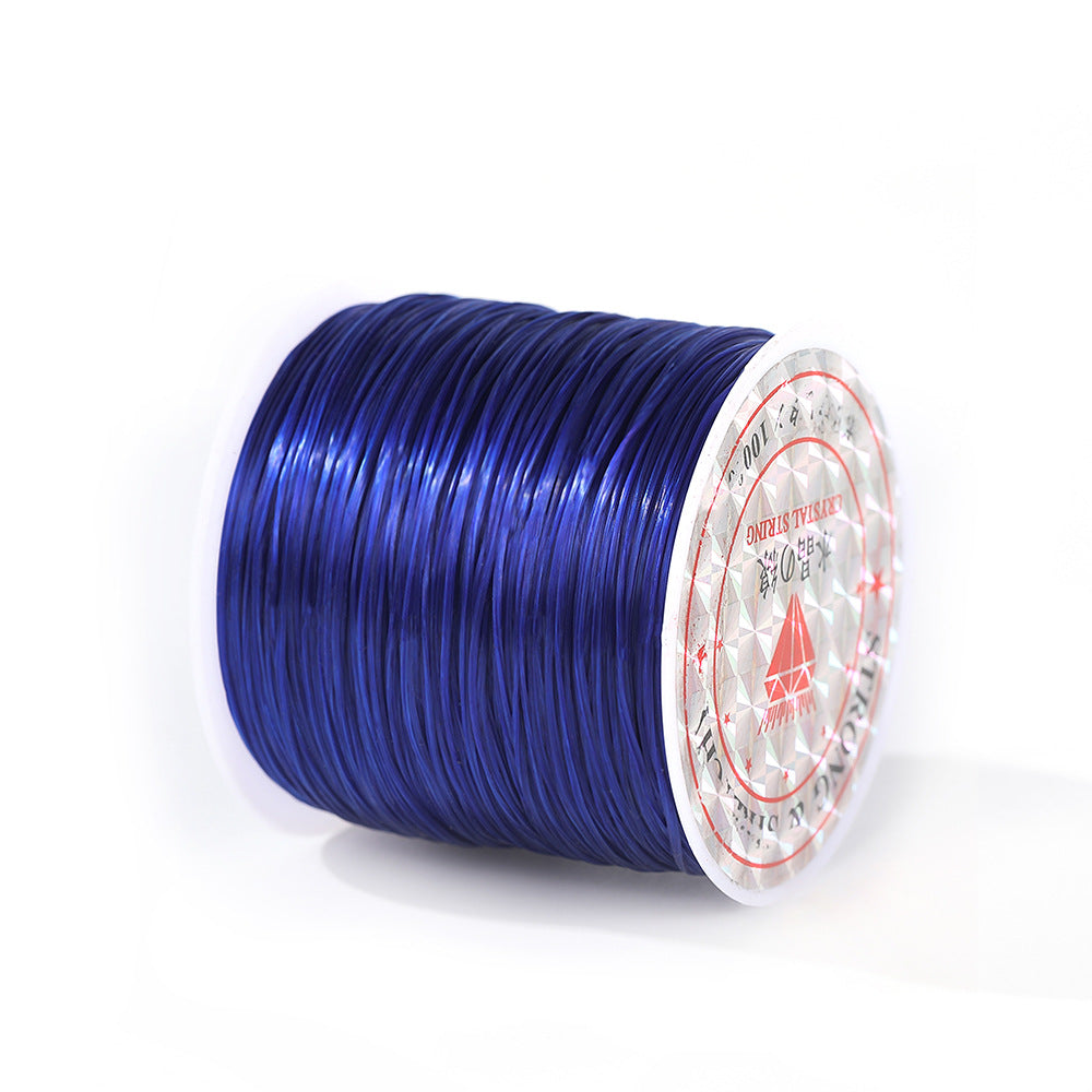 Spool of deep blue 0.8mm flat elastic beading cord with a white and red labeled end, on a white background