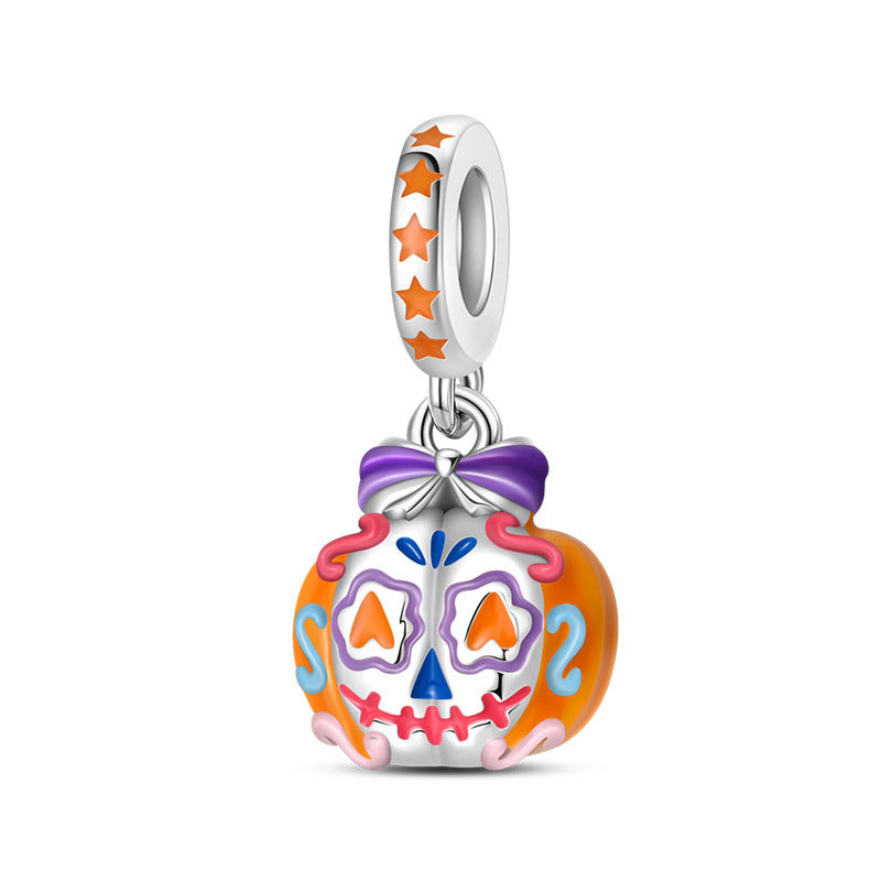 Silver-plated pumpkin skull dangle charm with orange pumpkin, colorful enamel face, and purple bow