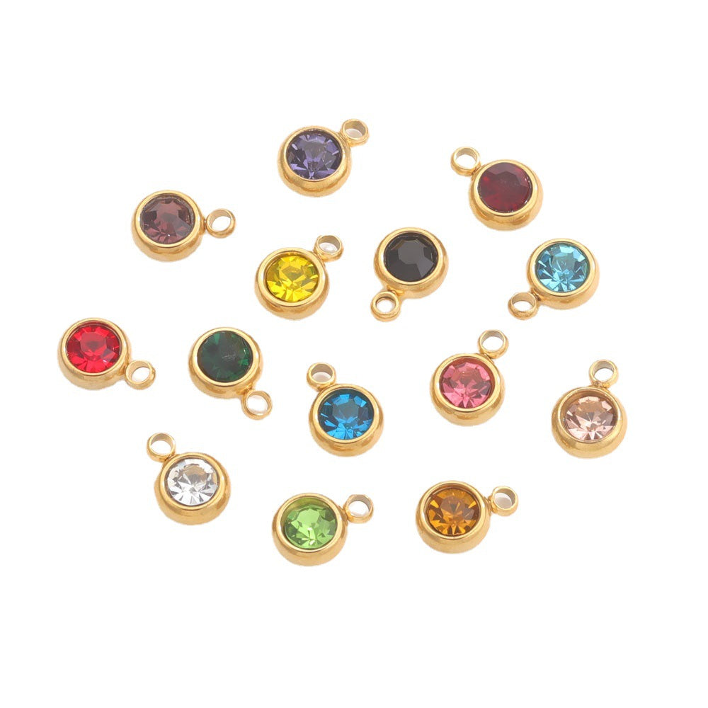Twelve gold-plated round crystal birthstone charms in various colors