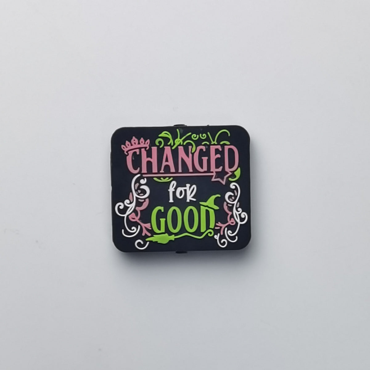 Square black bead with Changed for Good text in pink and green