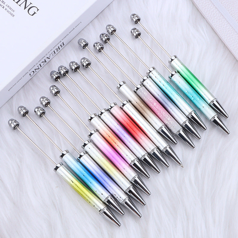Set of colorful ombre beadable pens on a white surface.