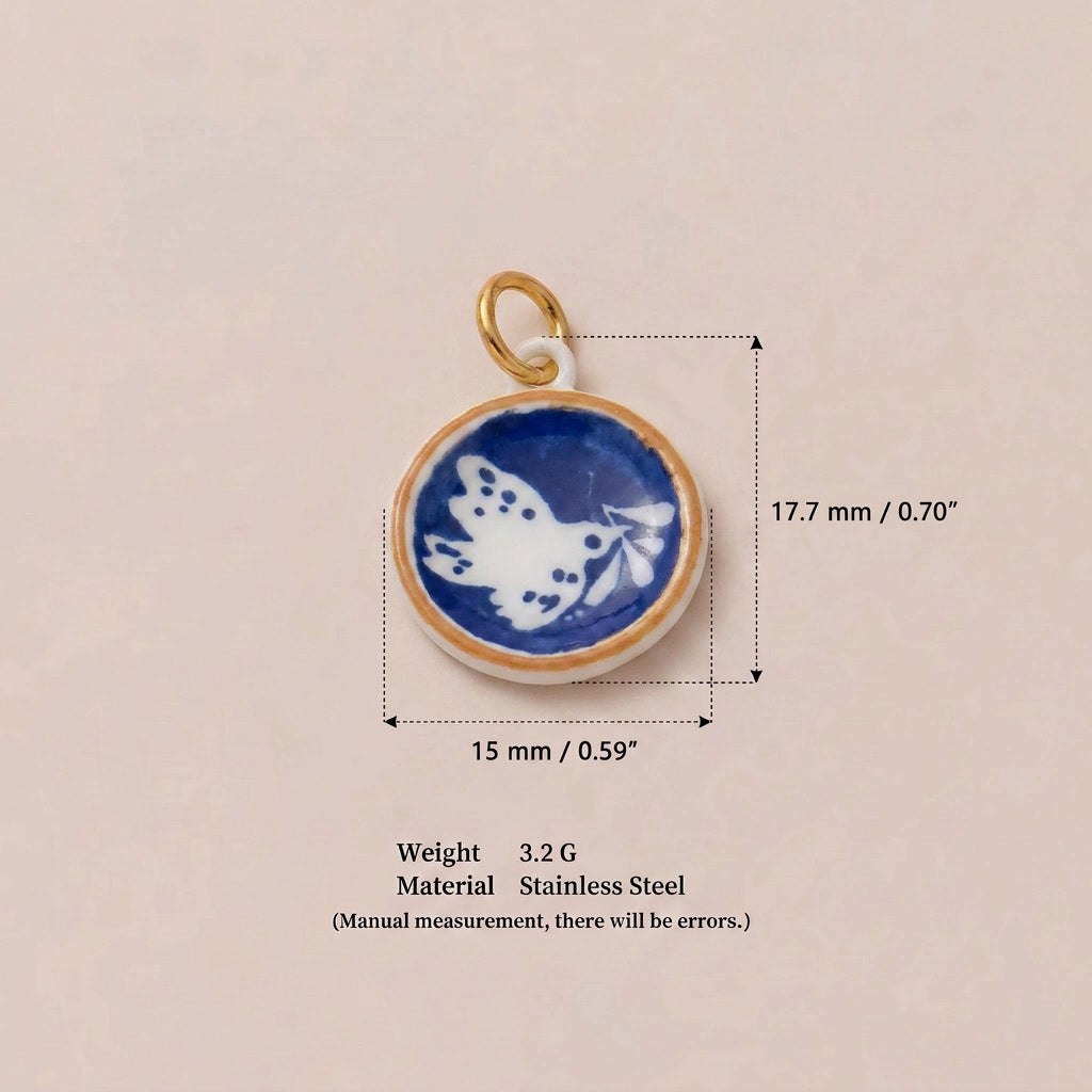 Round pendant charm with blue and white butterfly design, shown with size measurements.