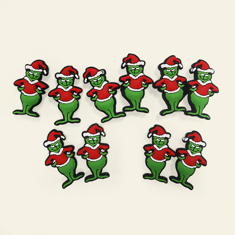 Ten green Grinch-style character charms in Santa outfits arranged in two rows on a light beige background.
