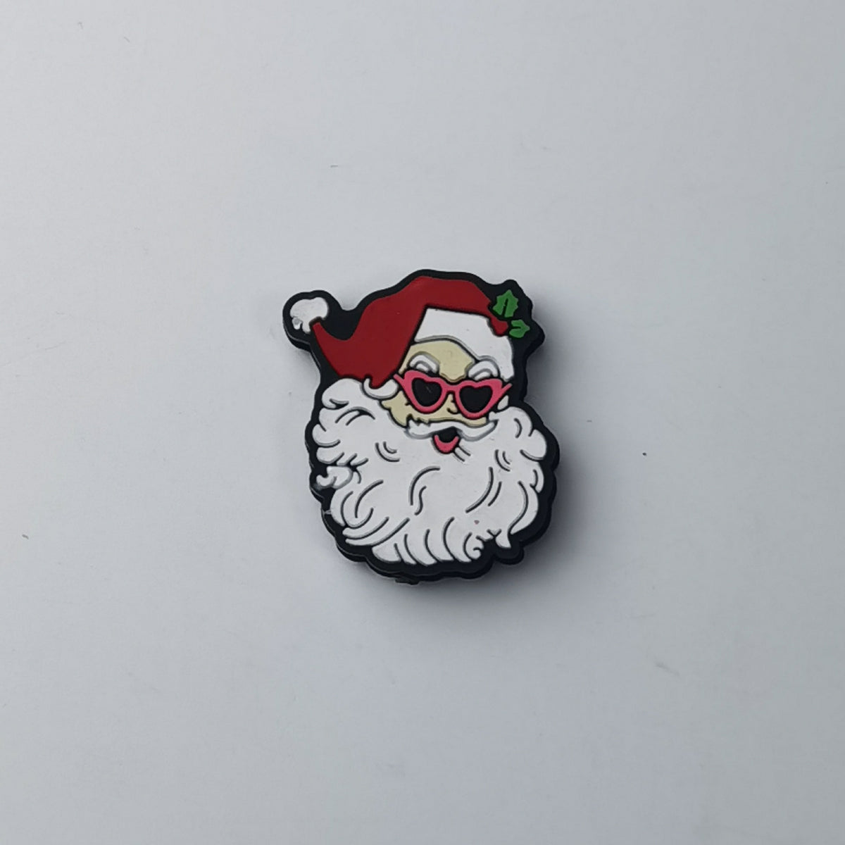Santa Claus face silicone focal bead with white beard, red hat and red heart-shaped sunglasses